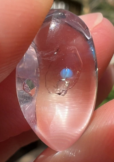 Polished Amethyst With Moving Petroleum Inclusion